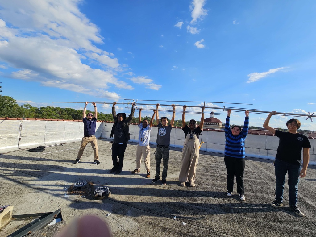 Me disassembling an antenna with my club members.